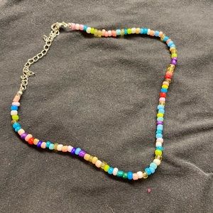 multi colored and white beaded necklaces